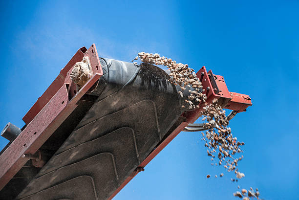 closeup conveyor belt carrying gravel