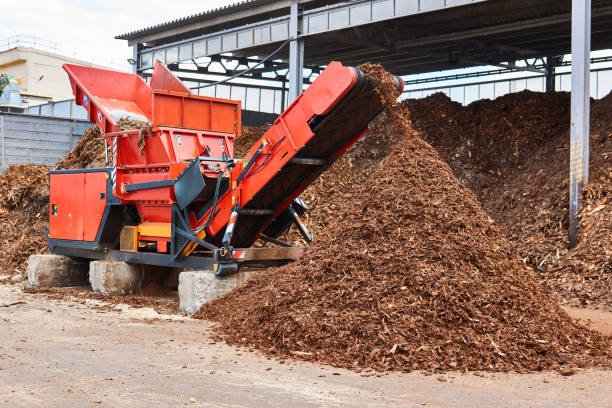 industrial wood shredder producing wood chips from bark